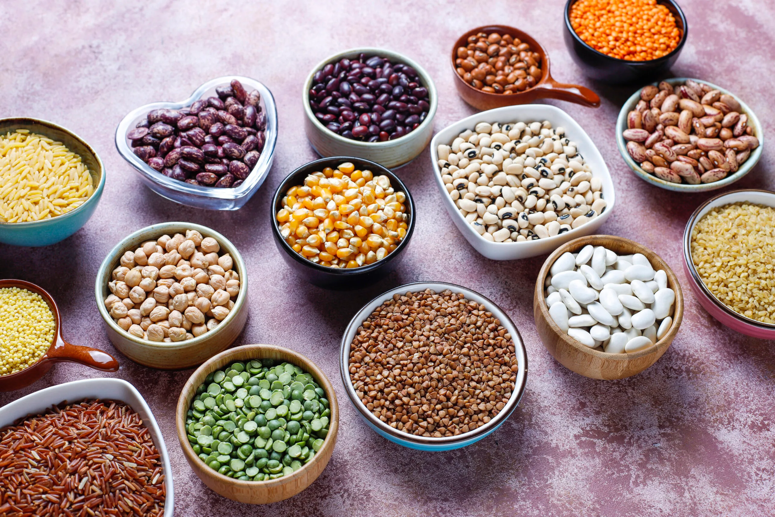 legumes-beans-assortment-different-bowls-light-stone-table-top-view-healthy-vegan-protein-food-scaled